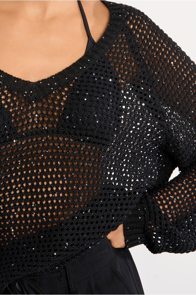 Jersey de mujer de manga larga, en punto acanalado.