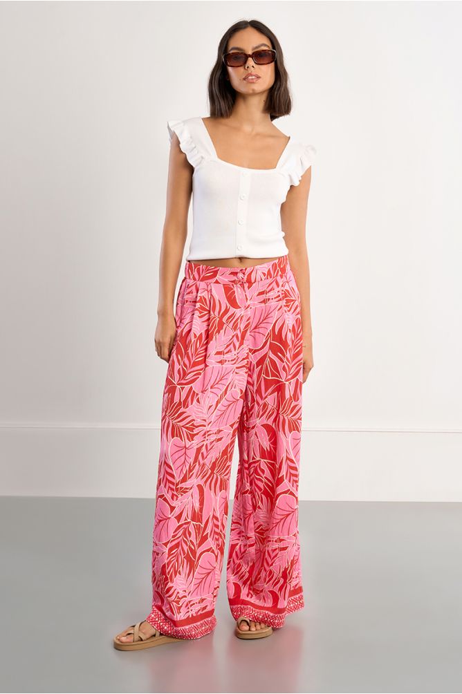 Pantalón de mujer largo, amplio, con estampado tropical.