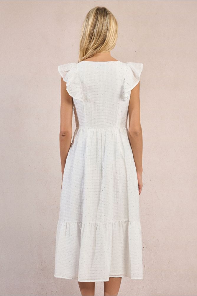 Vestido largo, de manga corta, con volantes y lunares.