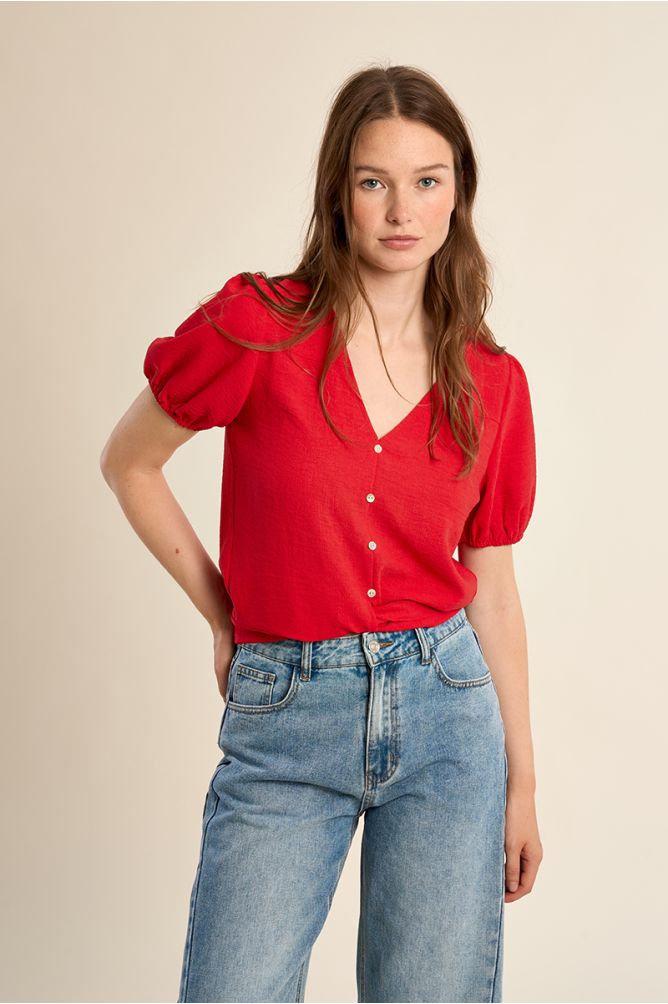 Top de mujer de manga corta, con lazada.