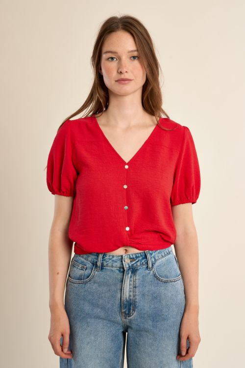 Top de mujer de manga corta, con lazada.