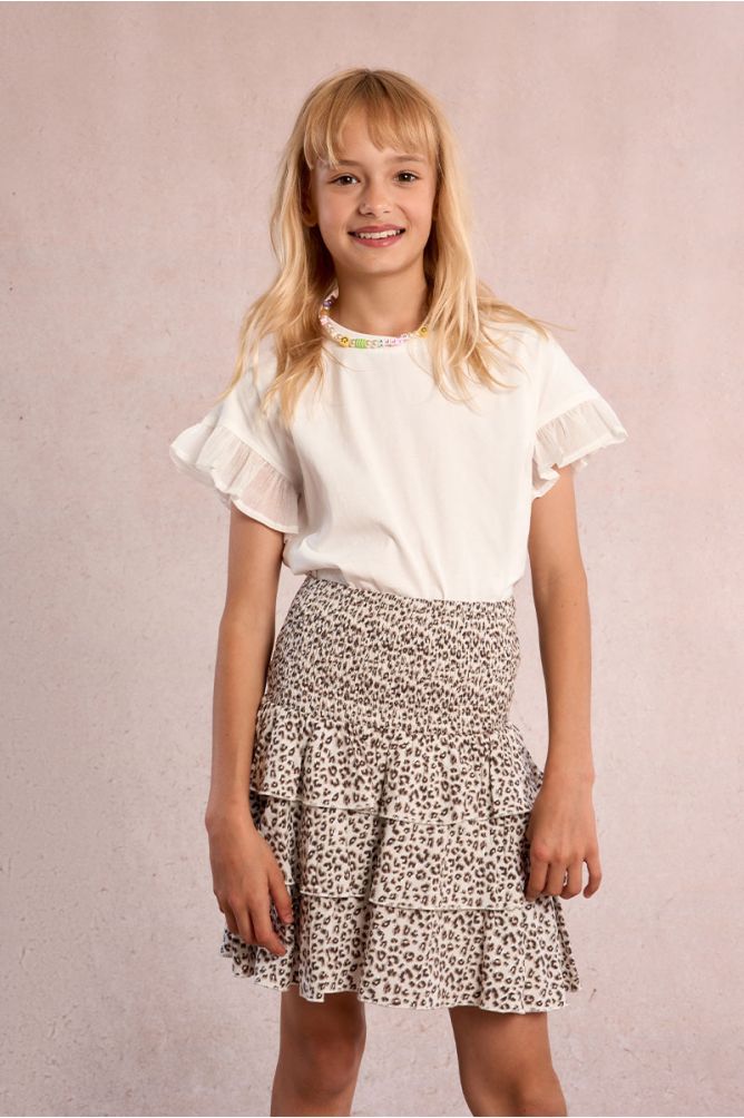 Falda de niña corta, con estampado y volantes.