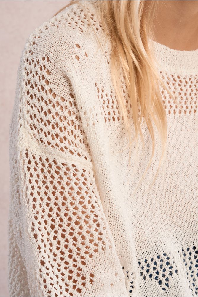 Jersey de niña de manga larga, detalle flores bordadas.