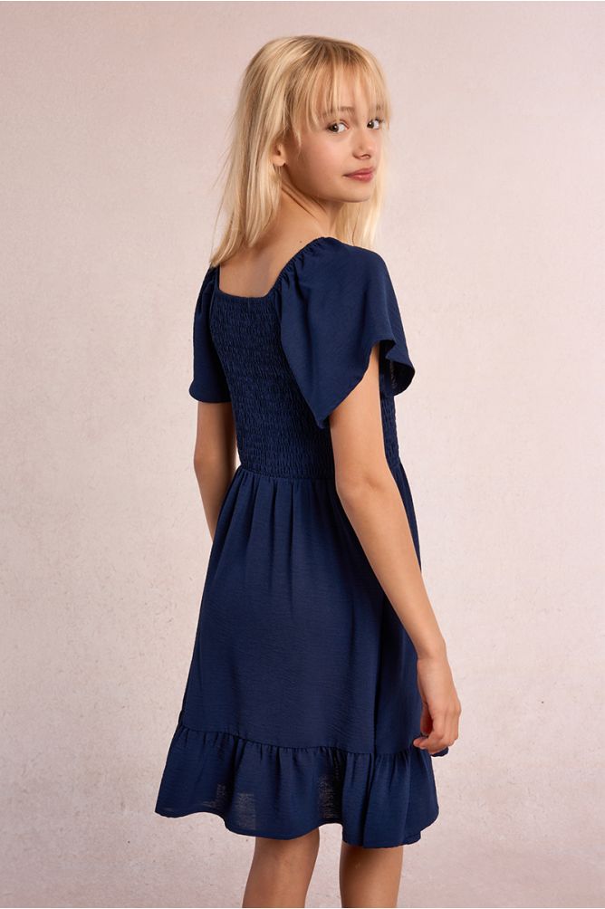 Vestido de niña de manga corta mariposa y volante.