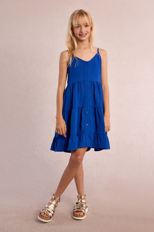 Vestido de niña de tirantes, con volantes y lazada.