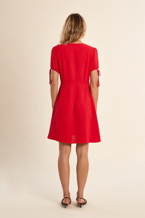 Short dress with knotted sleeves