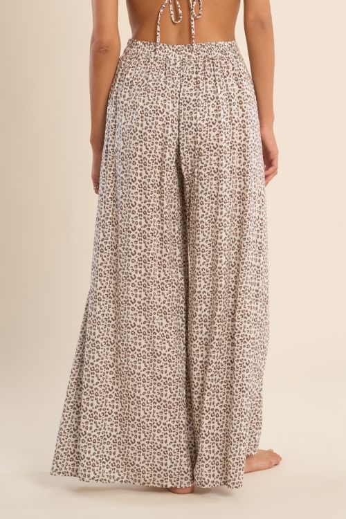 Pantalón de mujer largo, con estampado y lazada.